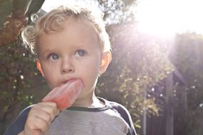 Boy eating popsicle