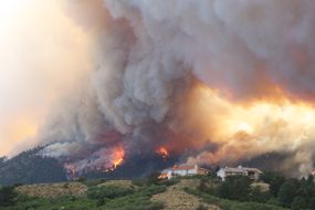 A wildfire burning near a Colorado