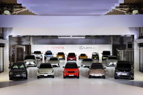 A fleet of Toyota vehicles in a showroom.