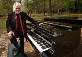 Chuck Leavell and piano in the trees