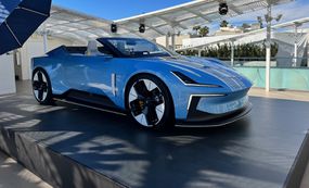 A blue Polestar 02 vehicle on an outdoor display